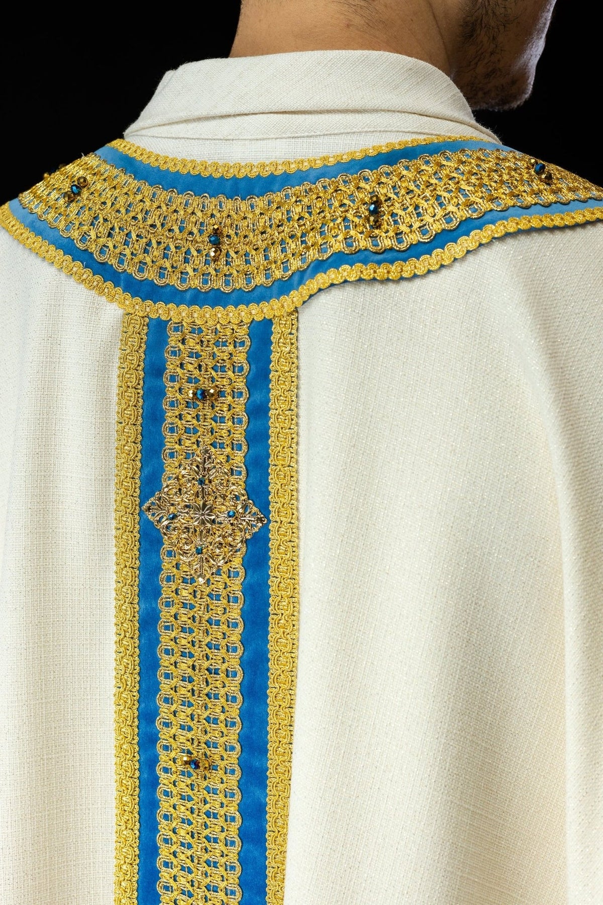 Handcrafted chasuble detail of front orphrey, sleeve embroidery and gold tassel trim