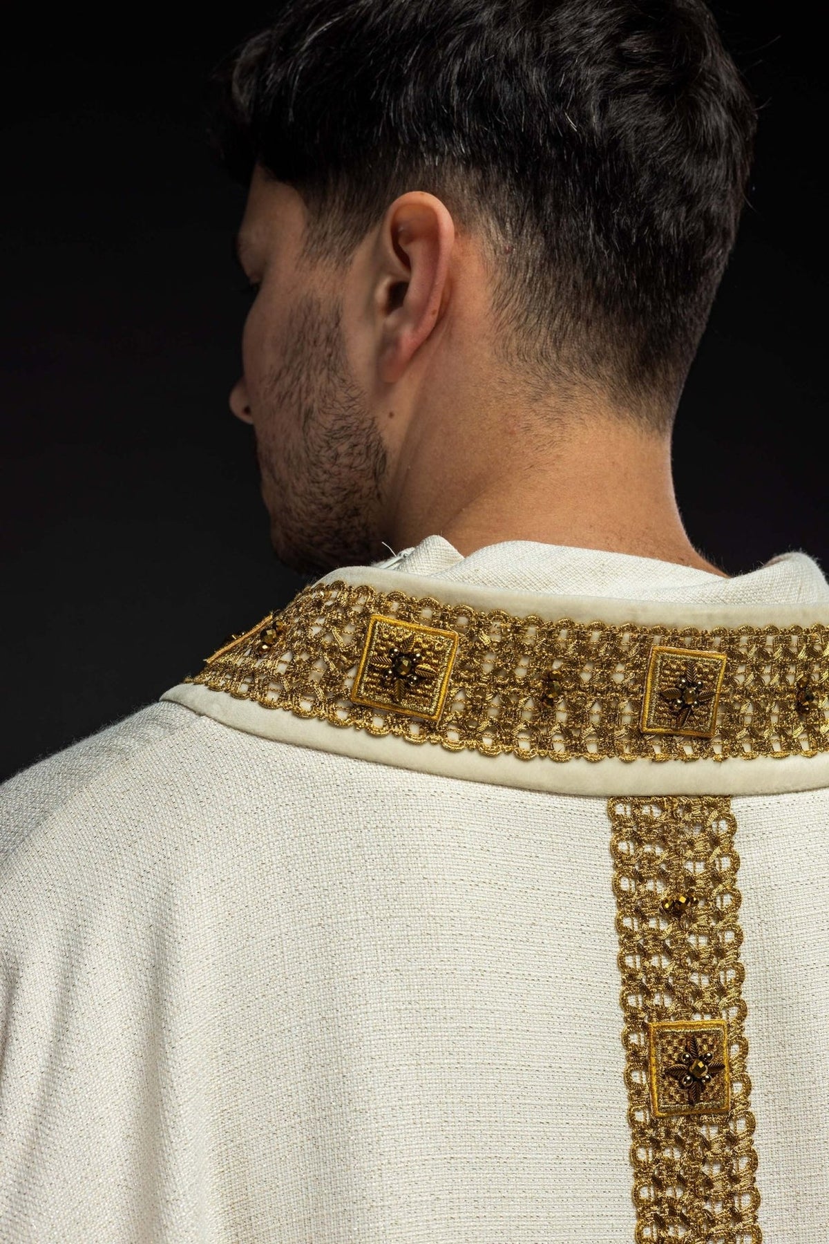 Ecru chasuble back view with gold collar and vertical orphrey