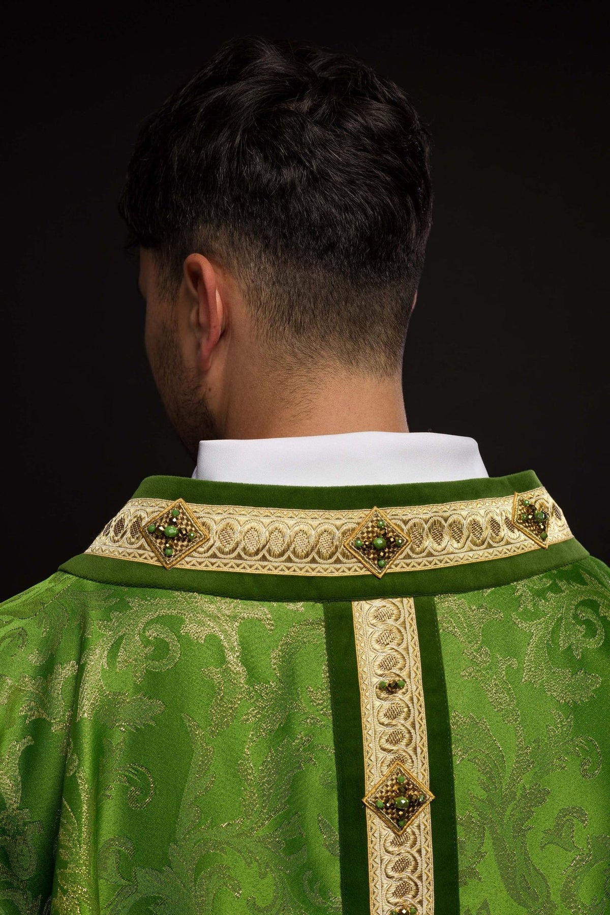 Handcrafted chasuble in green with gold embroidery, orphrey and natural stones, back view