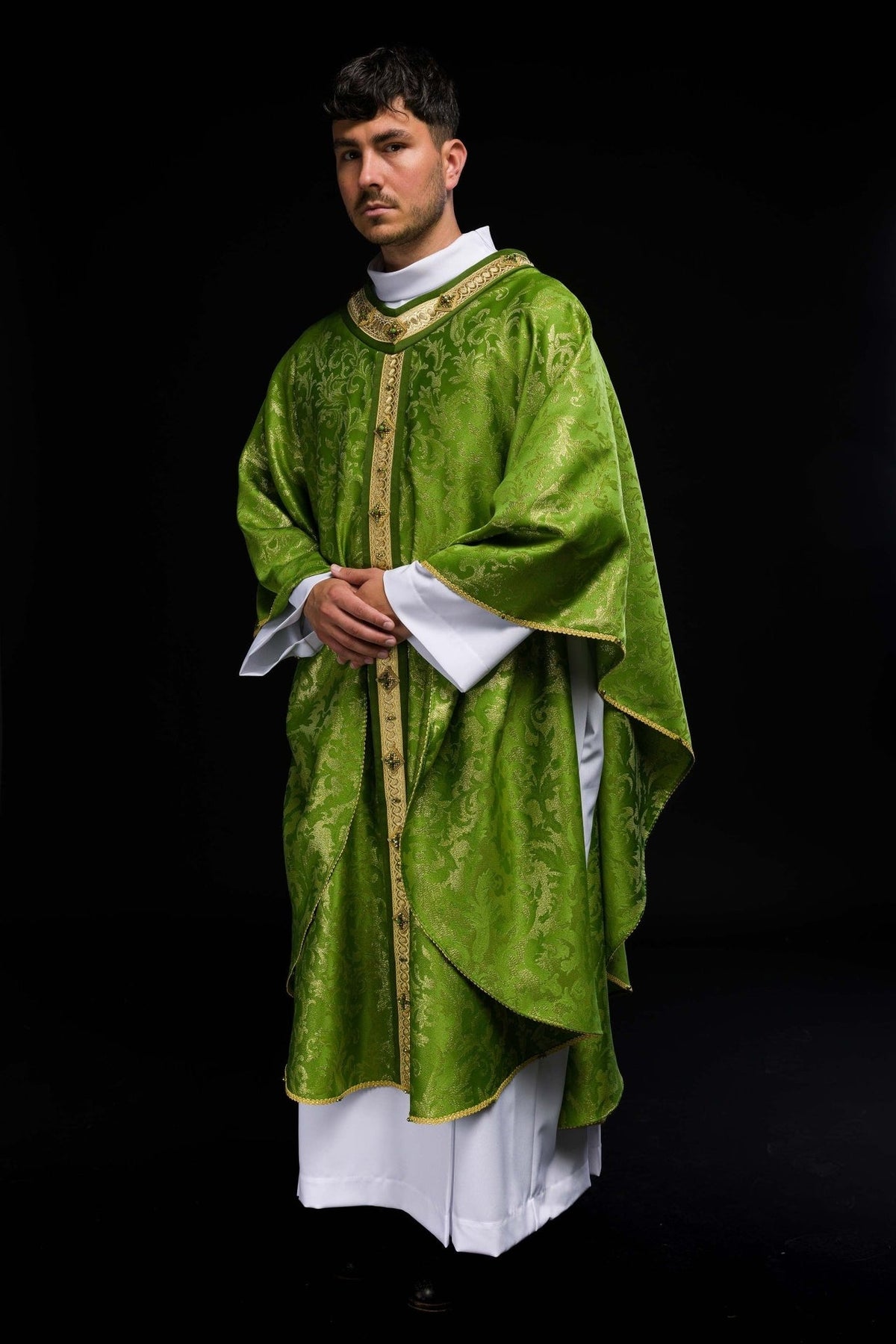 Handcrafted green chasuble worn, side view with gold embroidery and natural stones