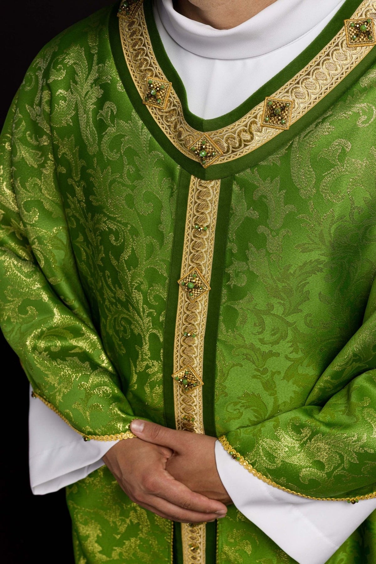 Green chasuble close-up showing gold orphrey, embroidery and natural stones