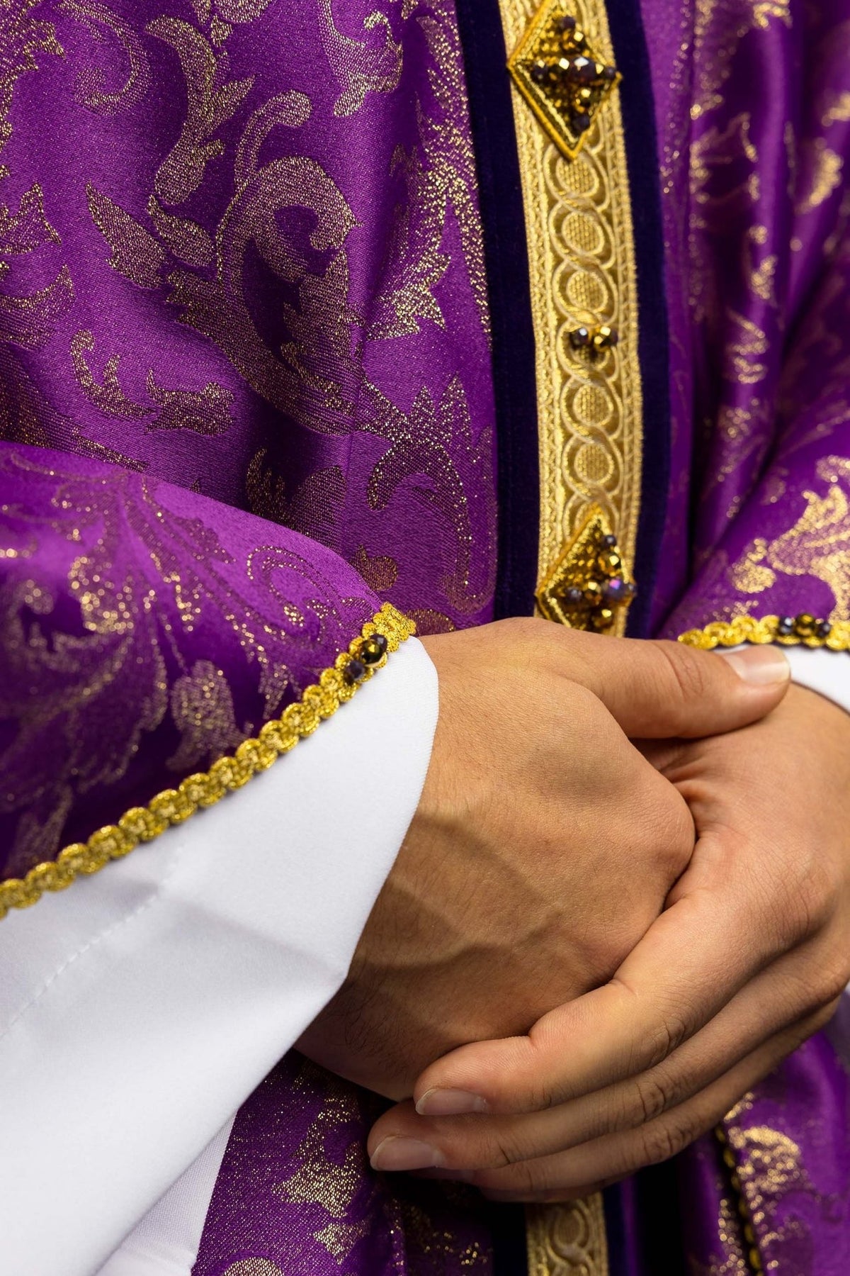 Purple chasuble front view with gold orphrey, jacquard motifs and jeweled trim