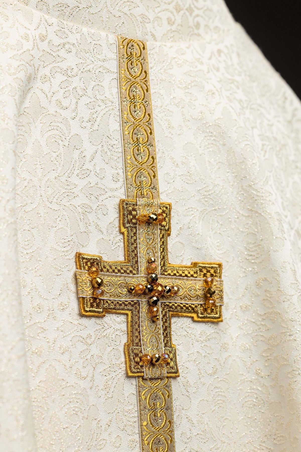 Chasuble cross detail with gold embroidery and amber-colored stones