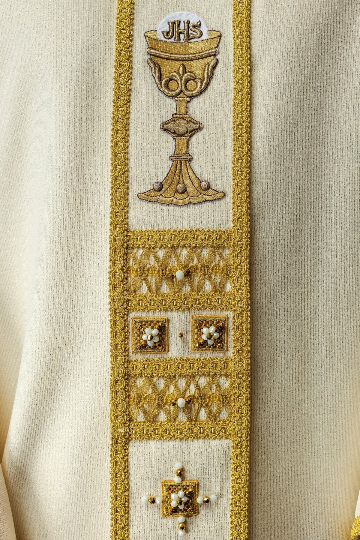 Chasuble front close-up showing gold chalice embroidery and beaded orphrey