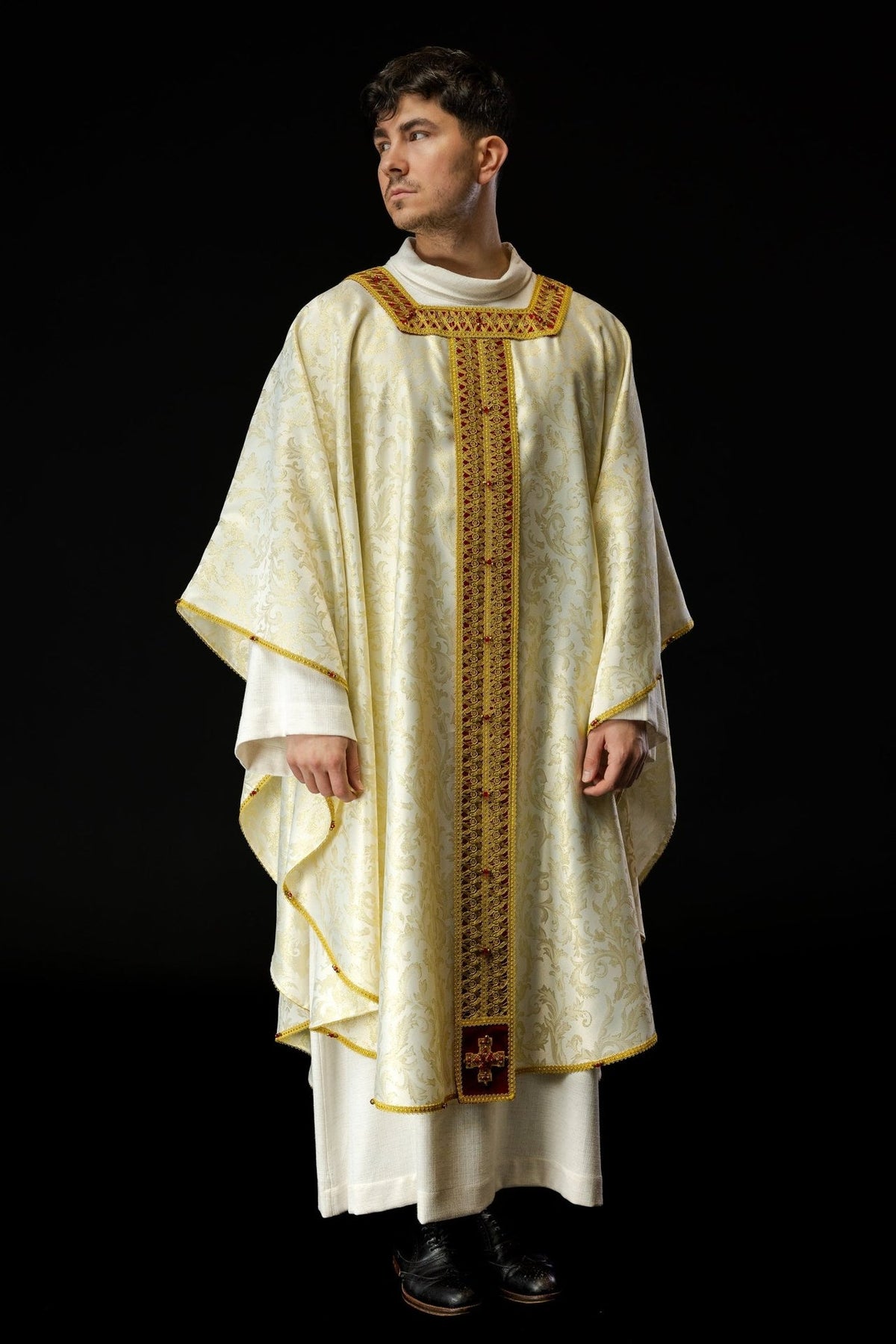 Handcrafted chasuble in full front view, ivory jacquard fabric with gold embroidery and red orphrey