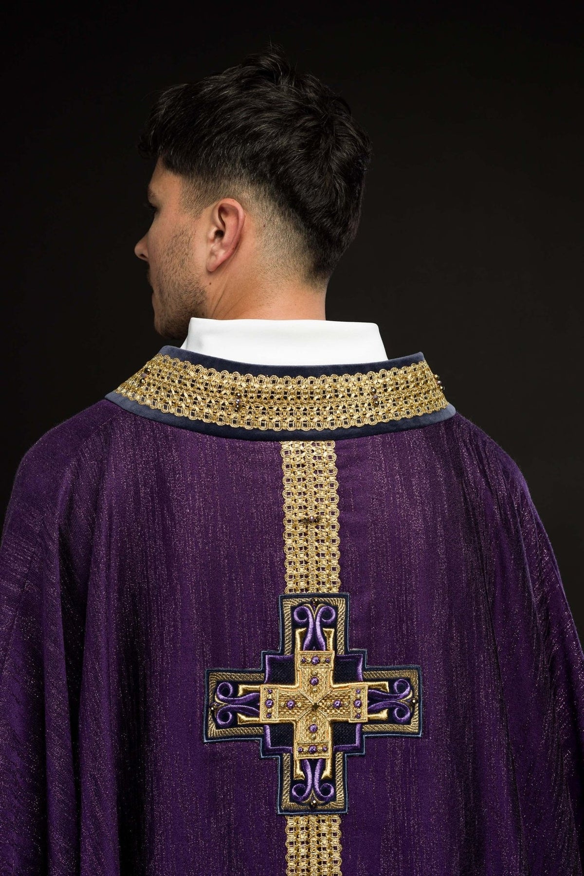 Handcrafted purple chasuble, back close-up with gold cross embroidery and natural stones