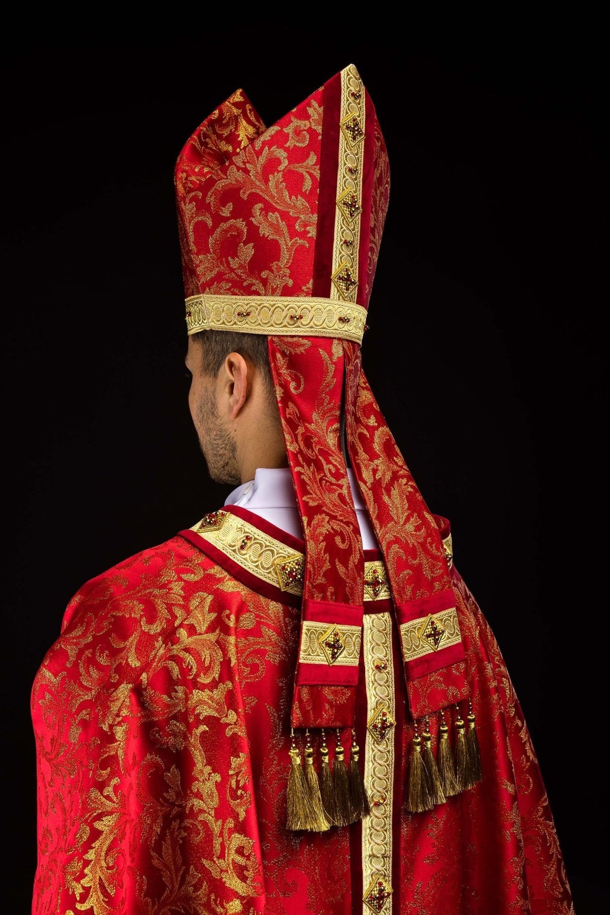 Red and gold miter side view with patterned fabric and embroidered band