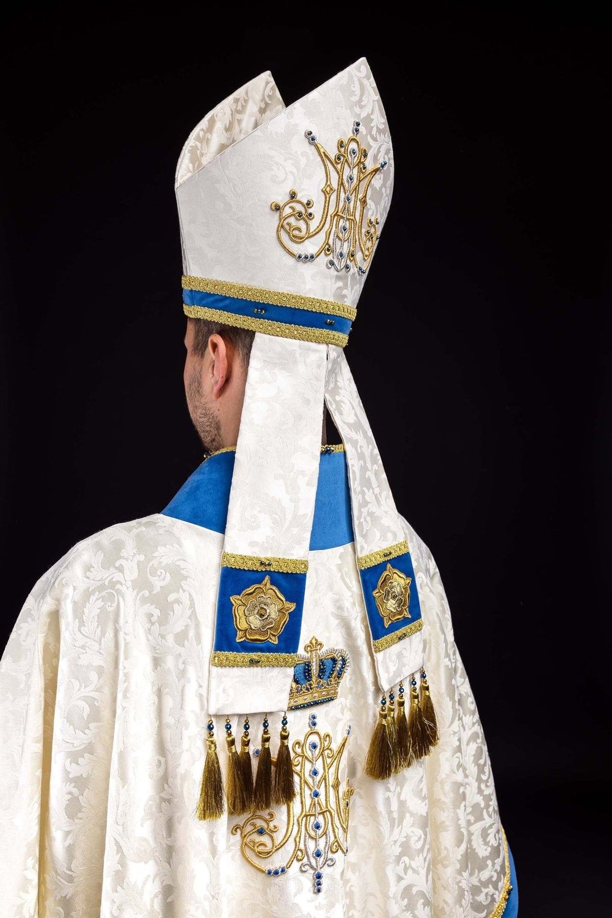 Marian miter front view with embroidered Marian symbol, blue stones and gold trim