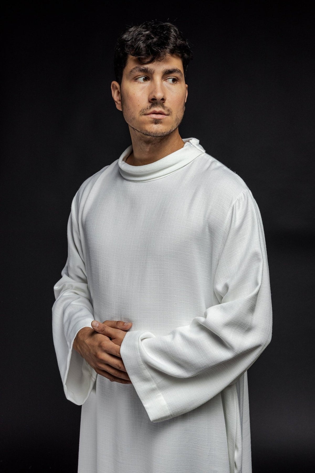 White linen priest alb, front view with rounded collar and wide sleeves