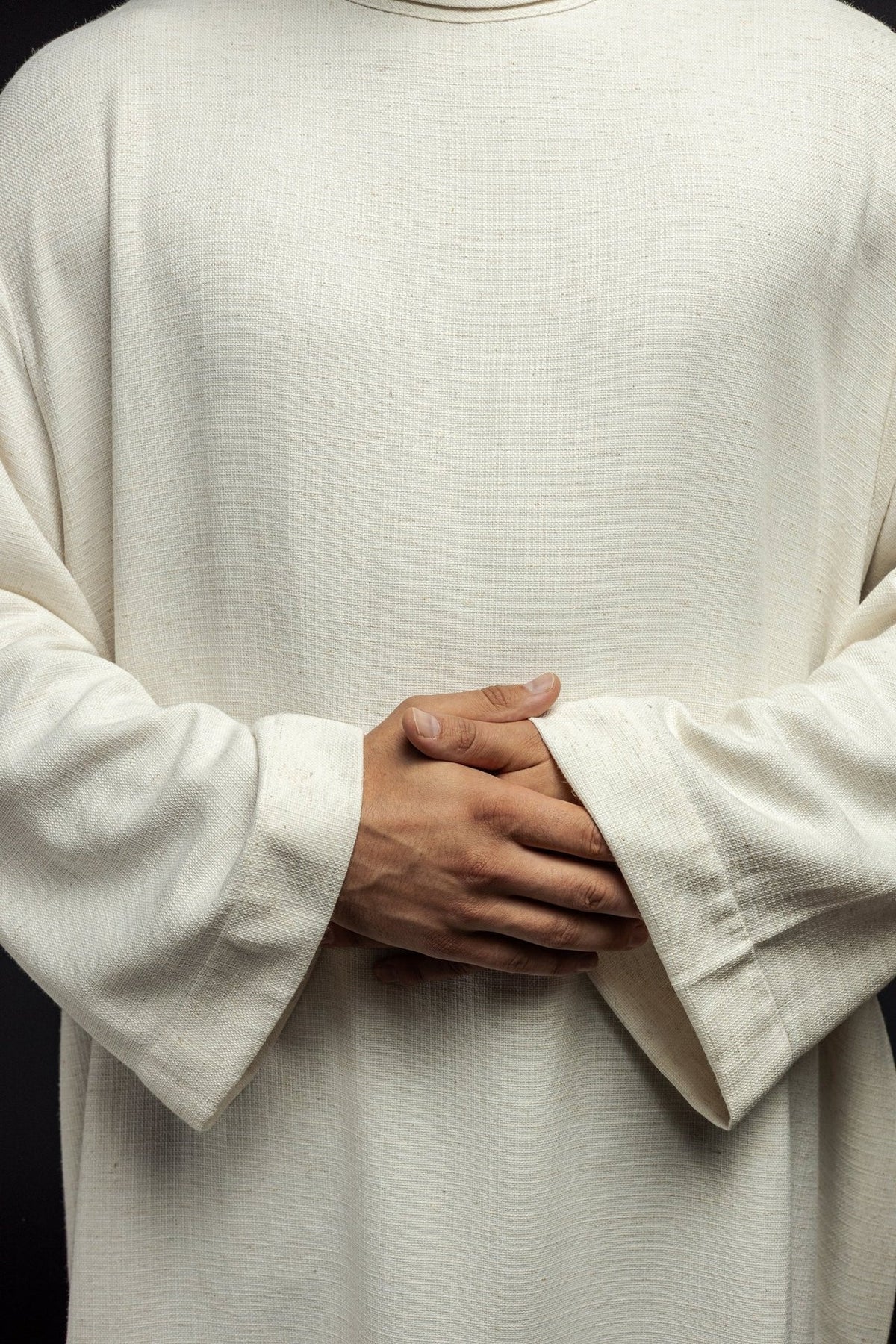 Linen priest alb in ecru, close-up of natural-weave linen fabric and wide cuffs