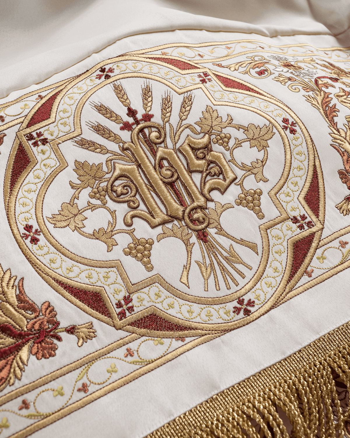 Processional canopy close-up with embroidered Chi Rho, wheat and vine motifs