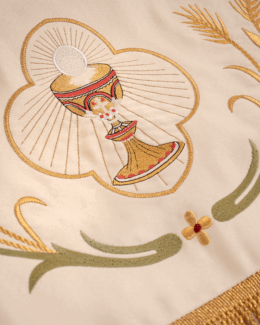 Corpus Christi canopy close-up showing embroidered gold chalice and wheat motifs
