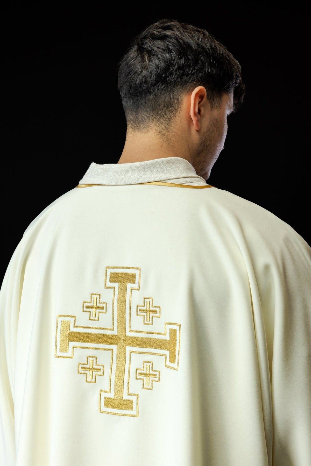 Ecru dalmatic back view with embroidered gold cross