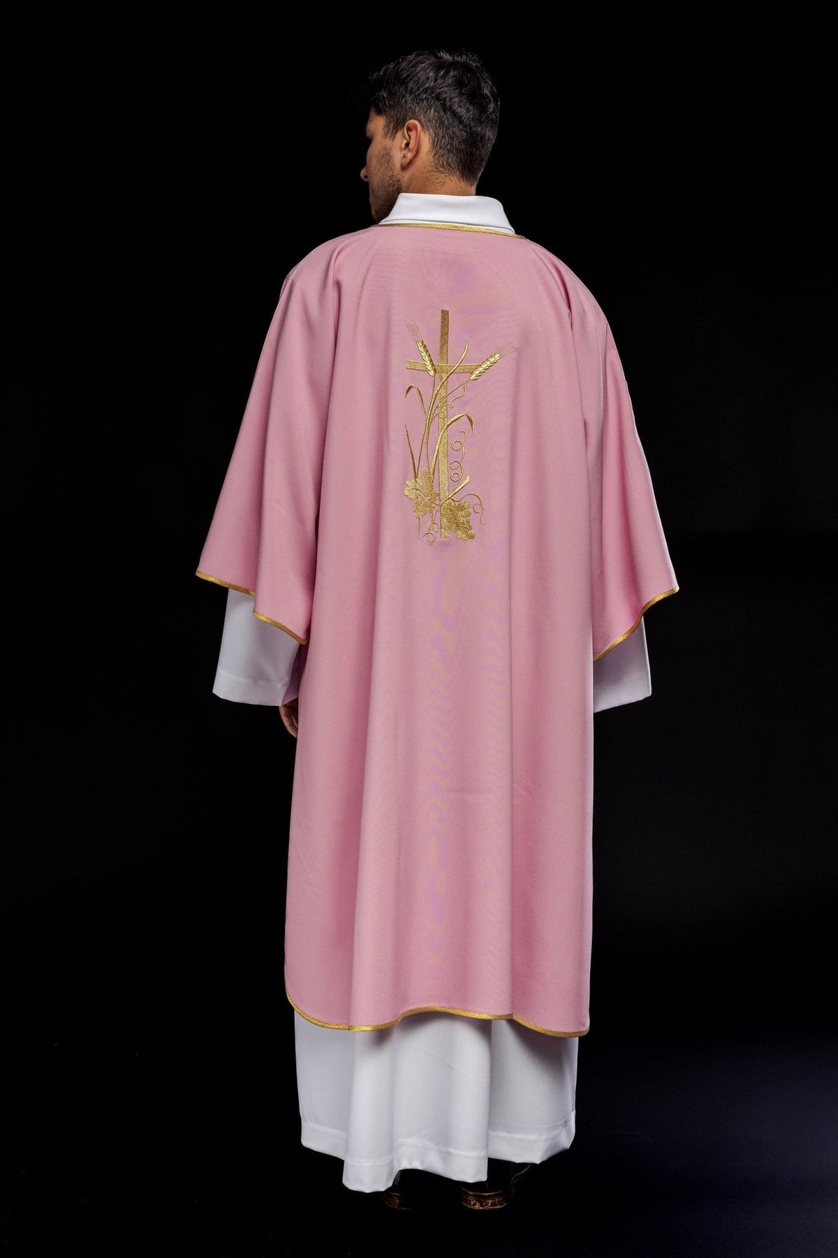 Rose dalmatic back view with central gold cross embroidery