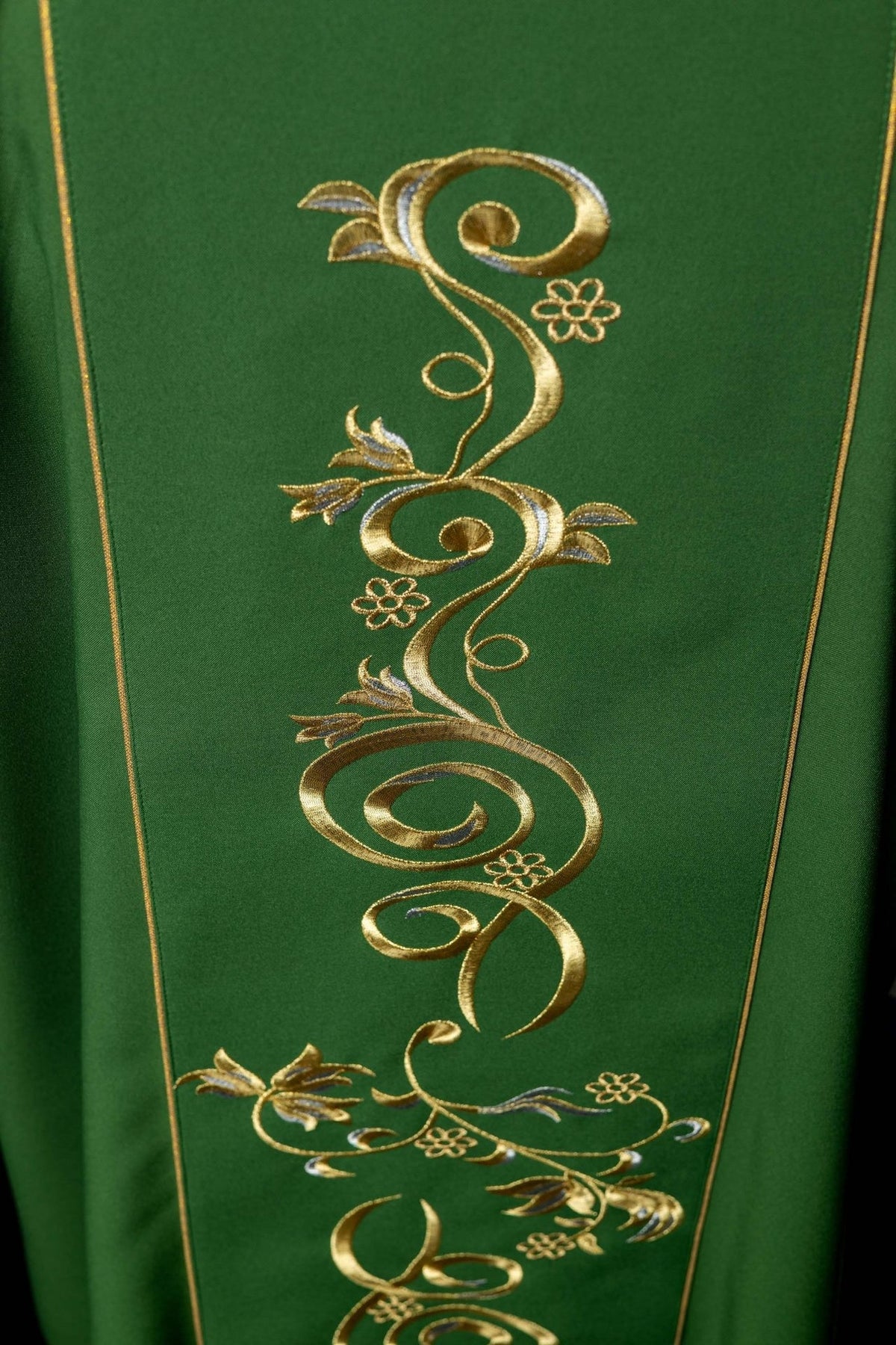 Green dalmatic close-up of gold floral embroidery on the front orphrey