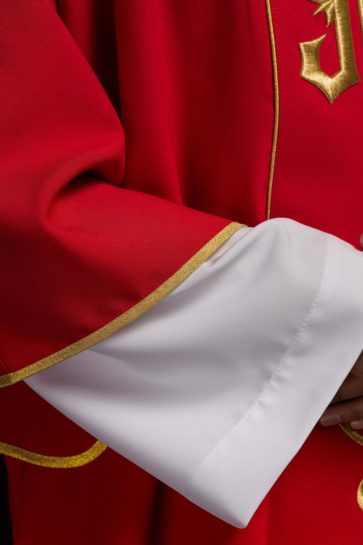 Red dalmatic lower front detail with gold floral embroidery