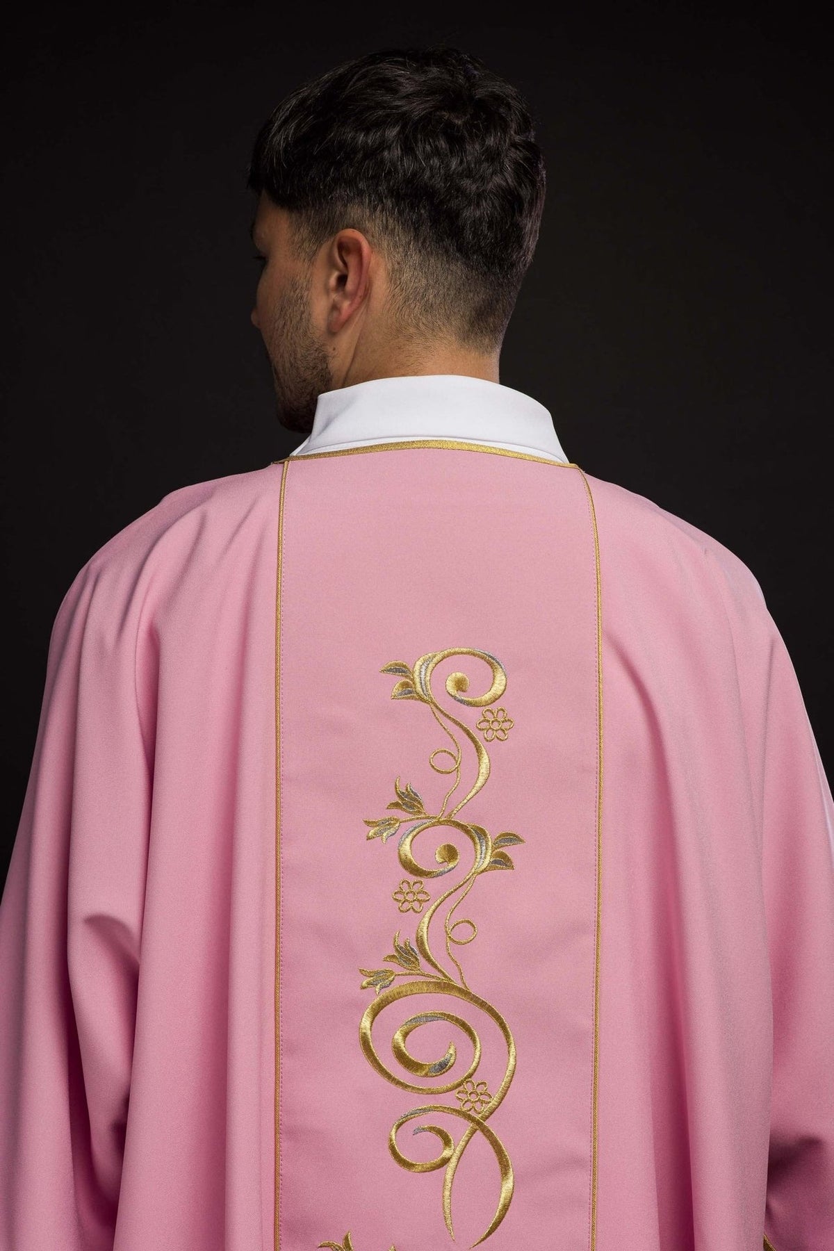 Rose dalmatic back view with floral gold embroidery
