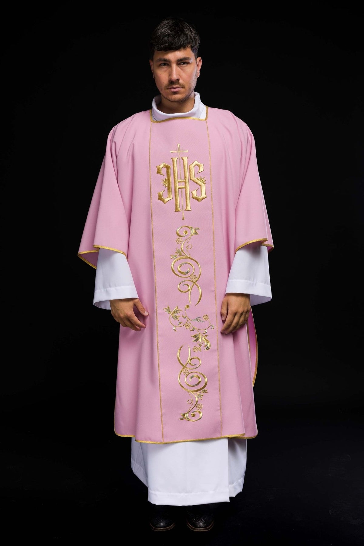 Rose dalmatic front view showing IHS and floral gold embroidery