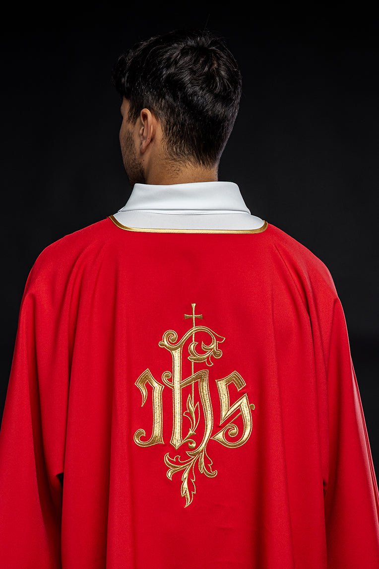 Red dalmatic with embroidered gold IHS design, back view