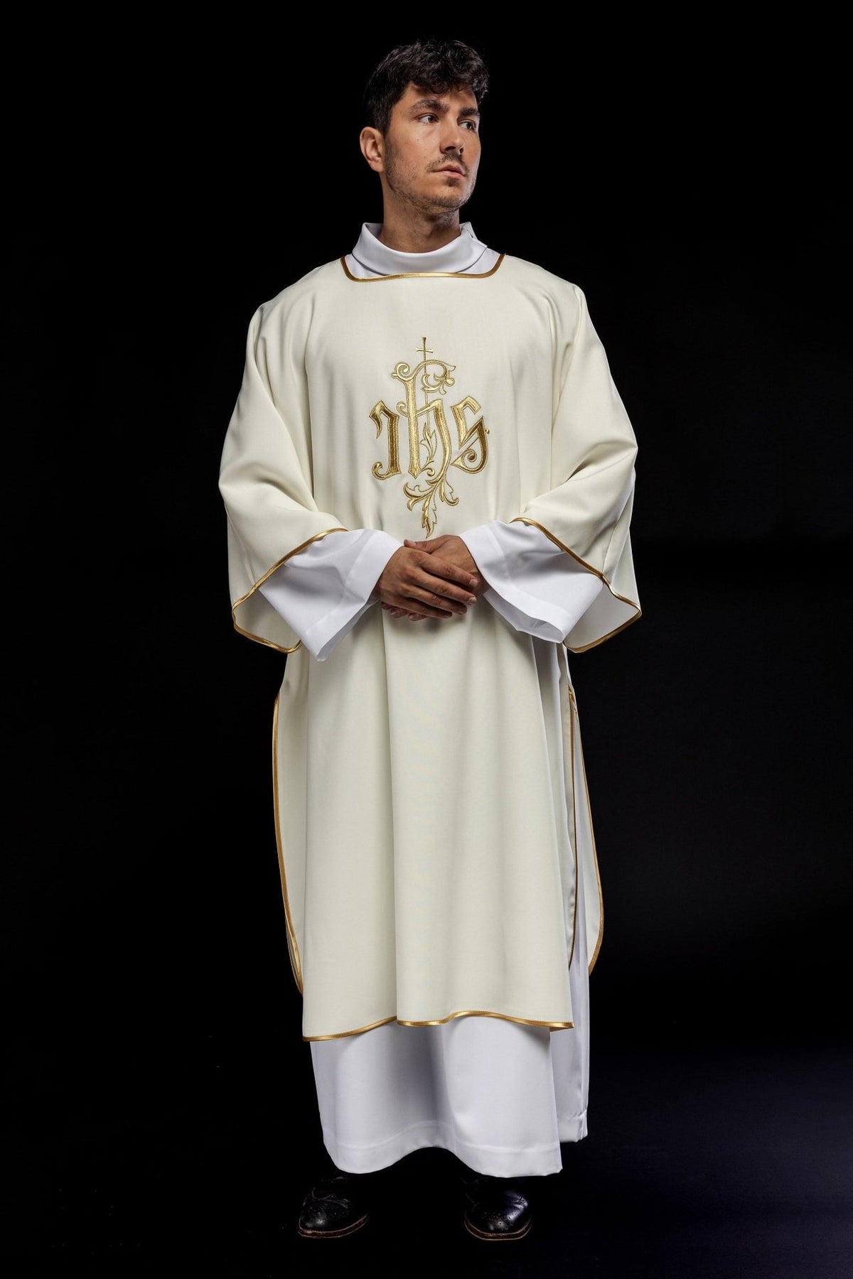 Ecru dalmatic front view showing wide sleeves, gold trim and IHS embroidery