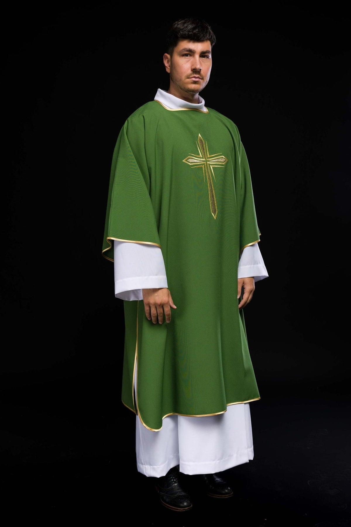 Green dalmatic angled front view with embroidered gold cross