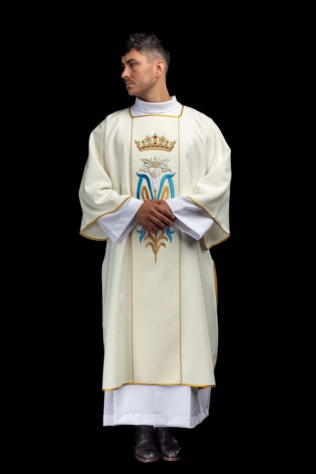 Ecru dalmatic worn front view with wide sleeves, Marian embroidery and gold trim
