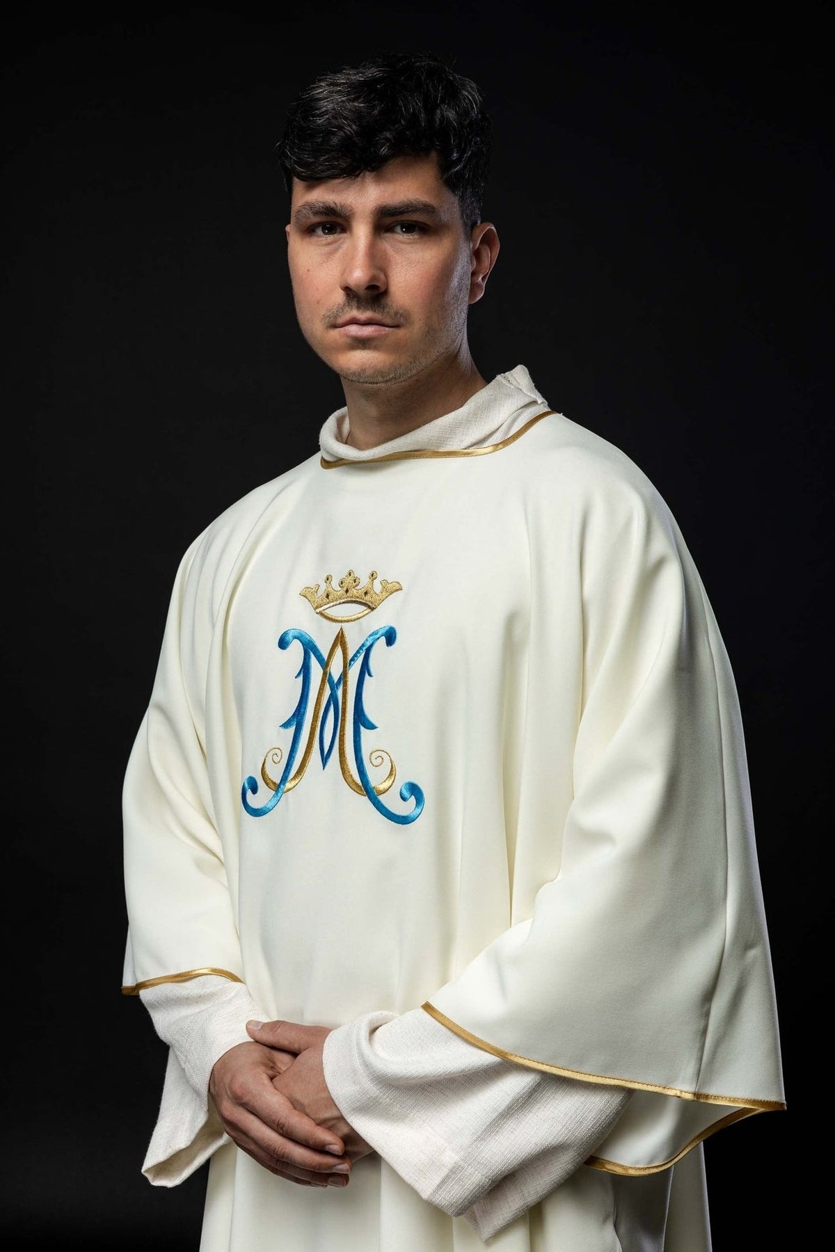 Ecru dalmatic three-quarter front view showing wide sleeves and gold trim