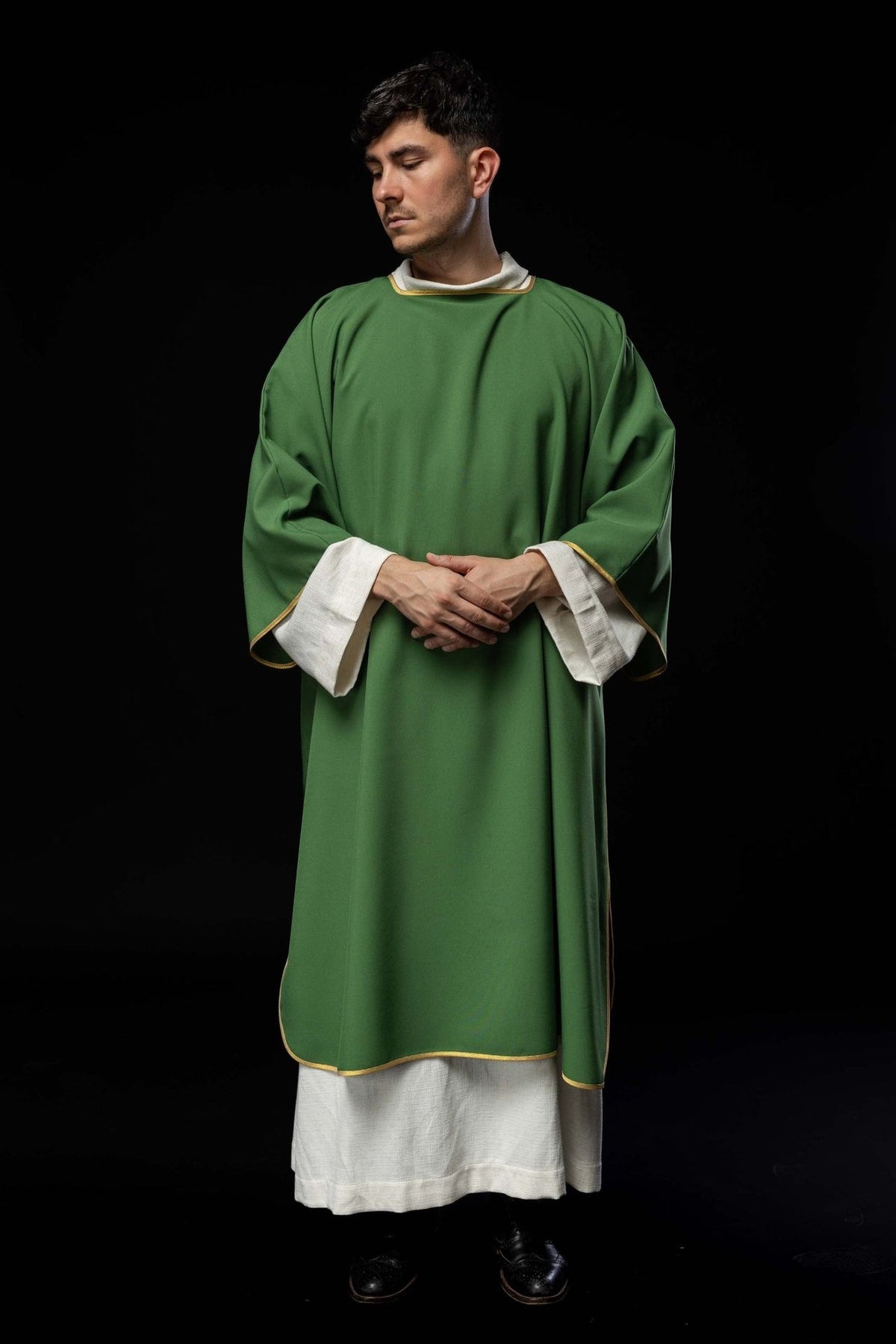 Green dalmatic, front view with wide sleeves and gold trim