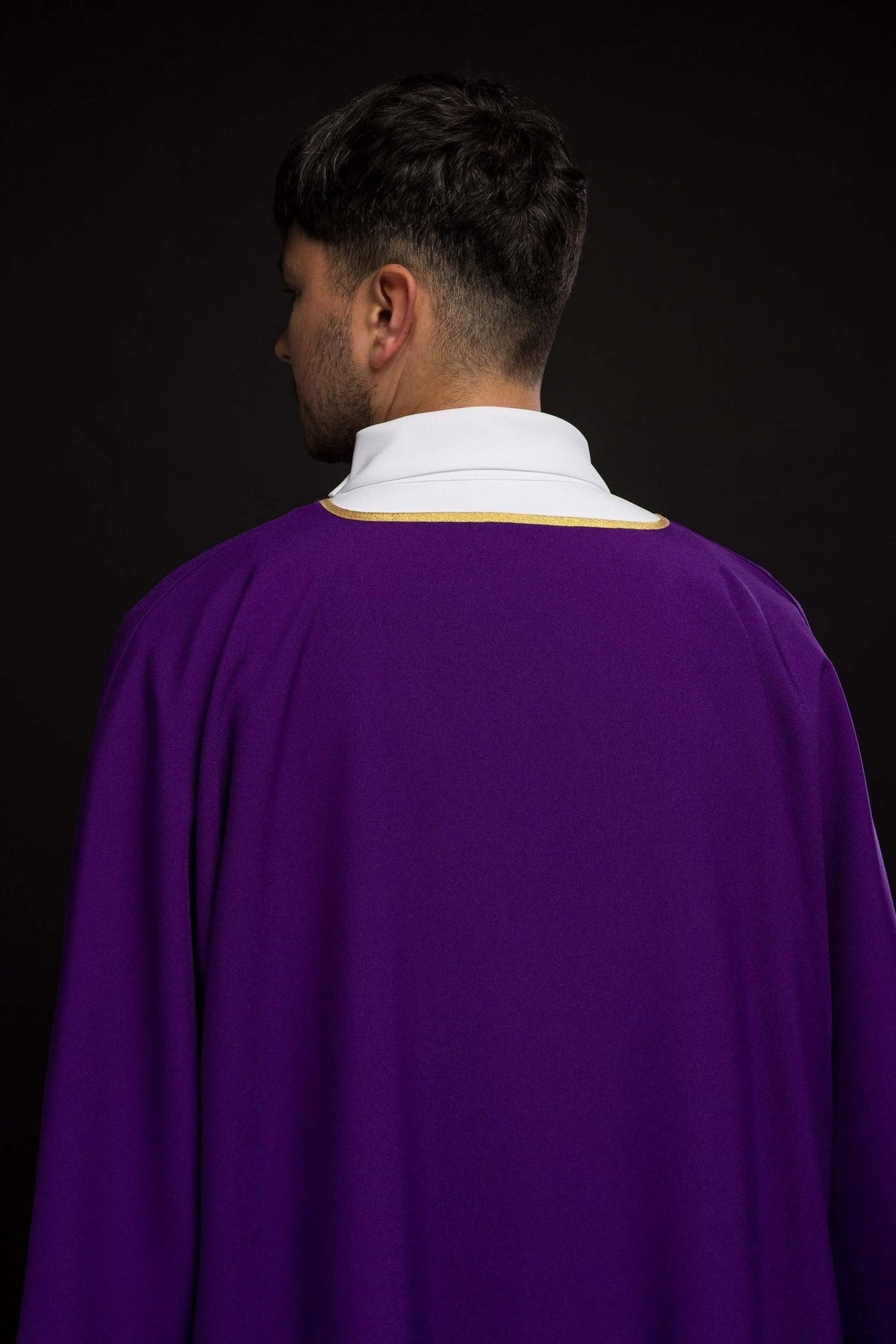 Purple dalmatic shown from the back with gold trim