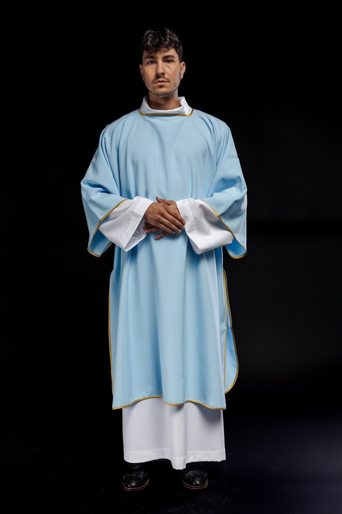 Blue dalmatic, full front view with white cuffs and gold trim