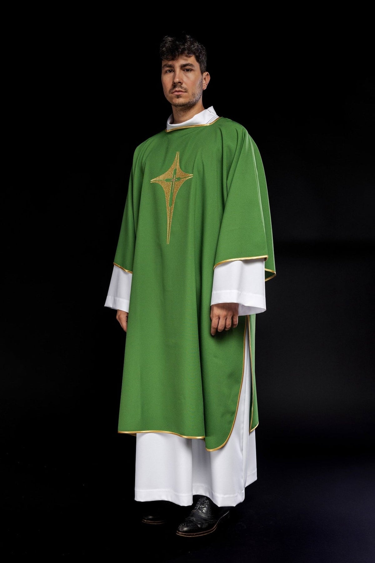 Green dalmatic side view showing gold trim and embroidered cross