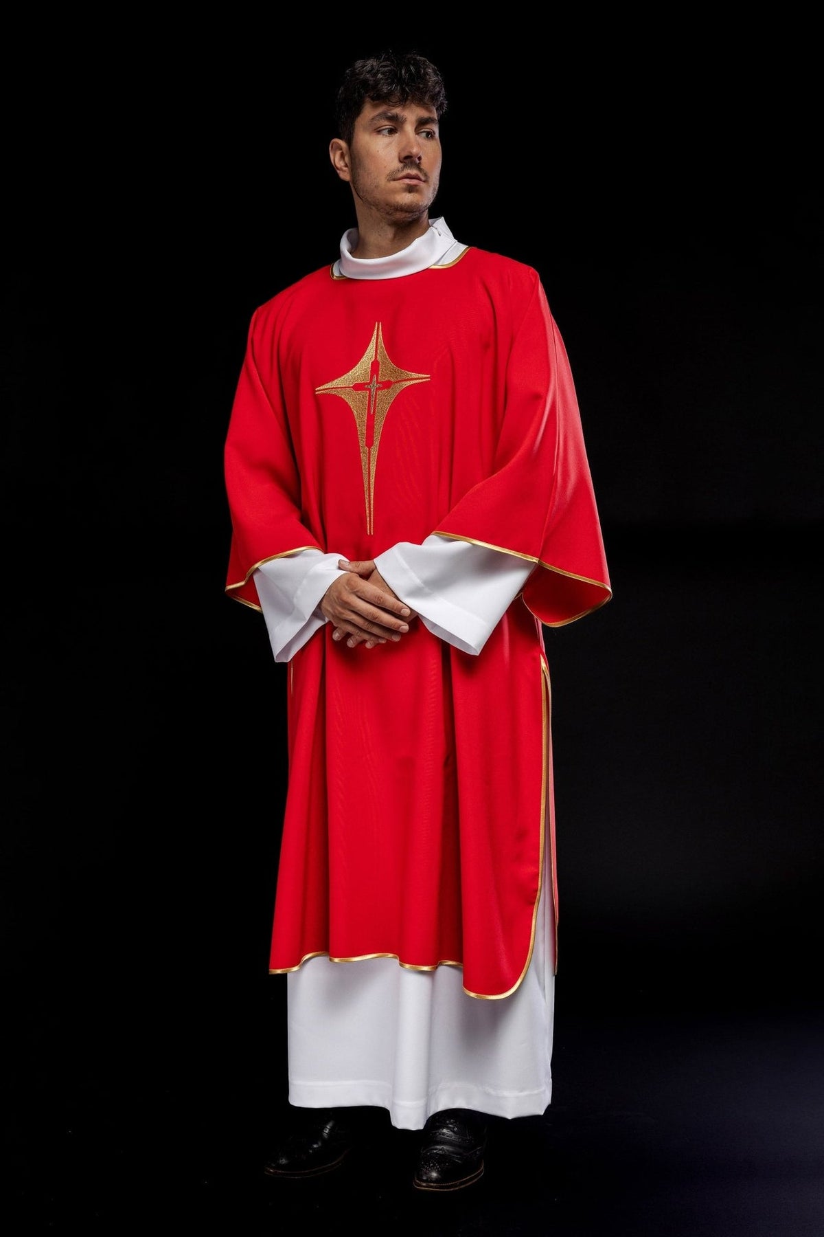 Red dalmatic angled view showing embroidered gold cross and gold trim