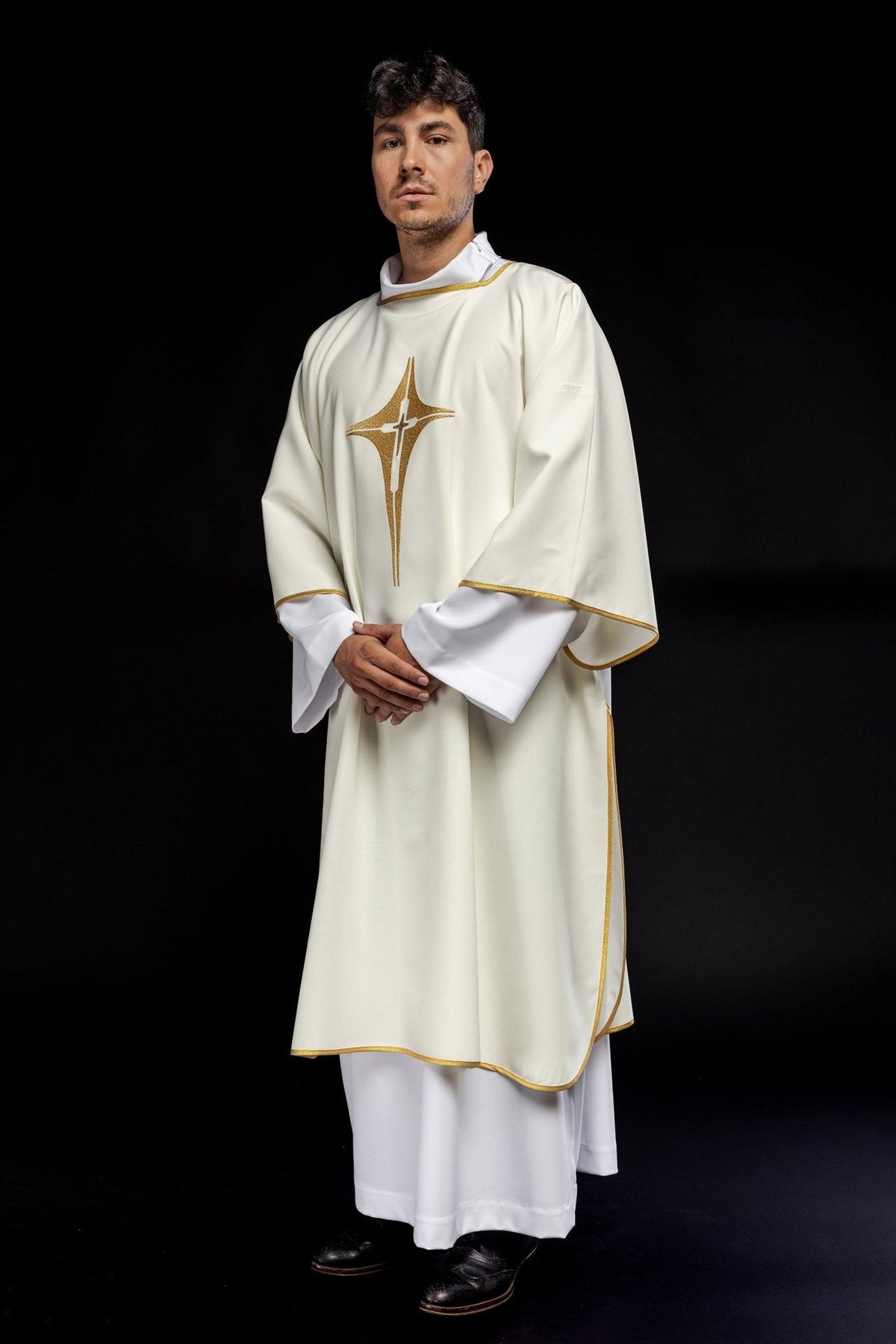 Ecru dalmatic with embroidered gold cross, angled front view