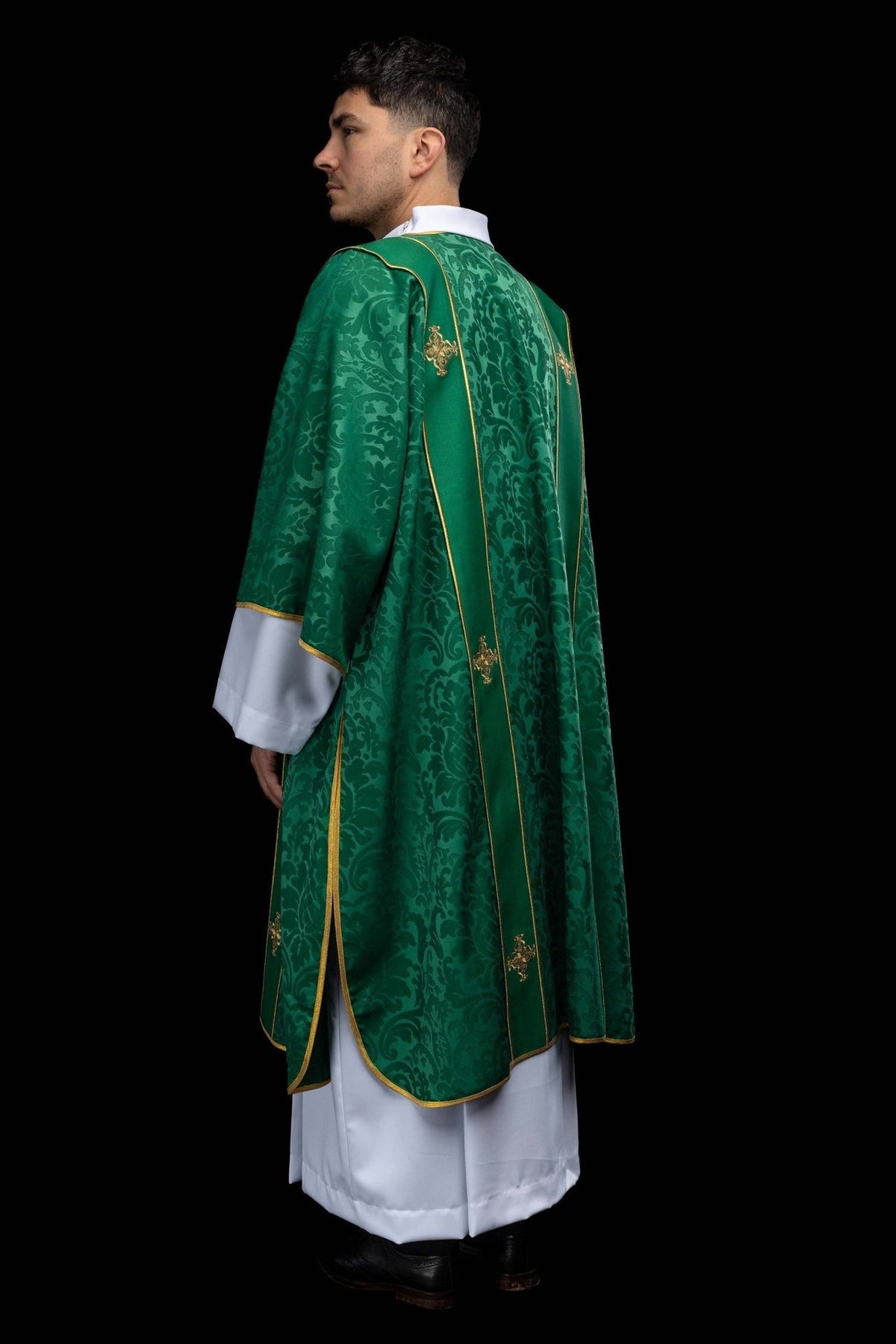 Green dalmatic back three-quarter view with patterned fabric and gold orphreys