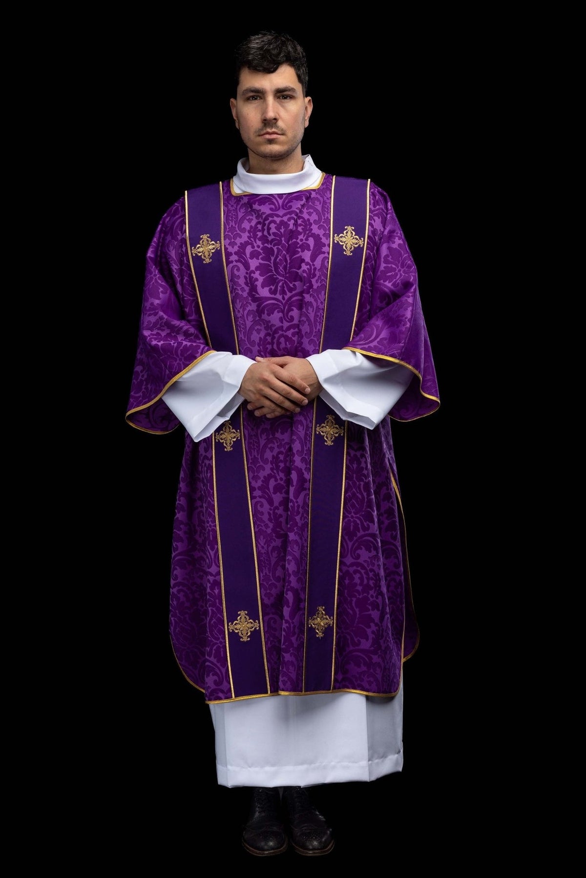 Purple dalmatic front view with gold orphreys and embroidered crosses