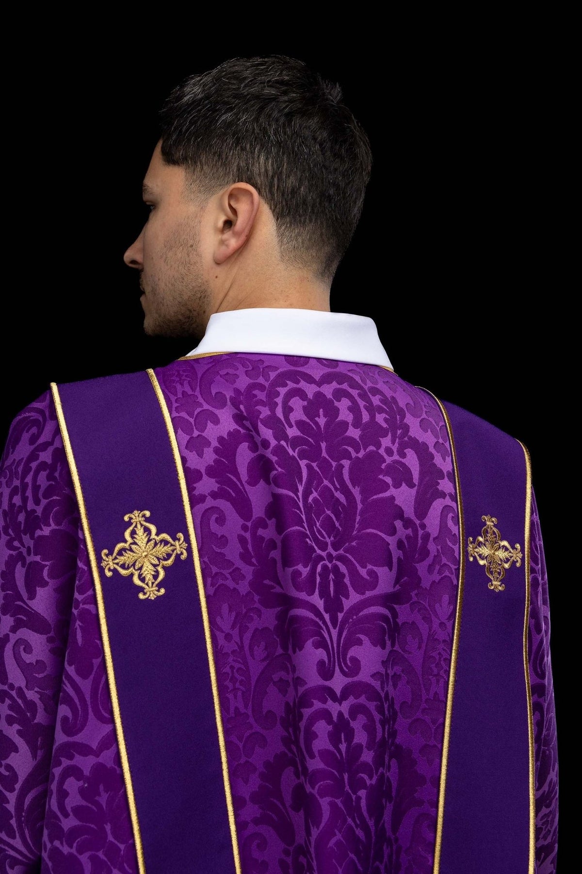Purple dalmatic front detail with floral jacquard fabric and gold orphrey