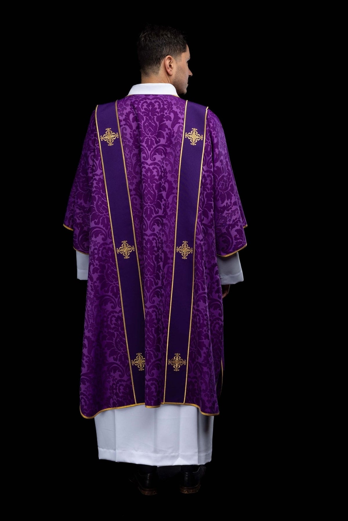 Purple dalmatic back view with gold orphreys and embroidered crosses