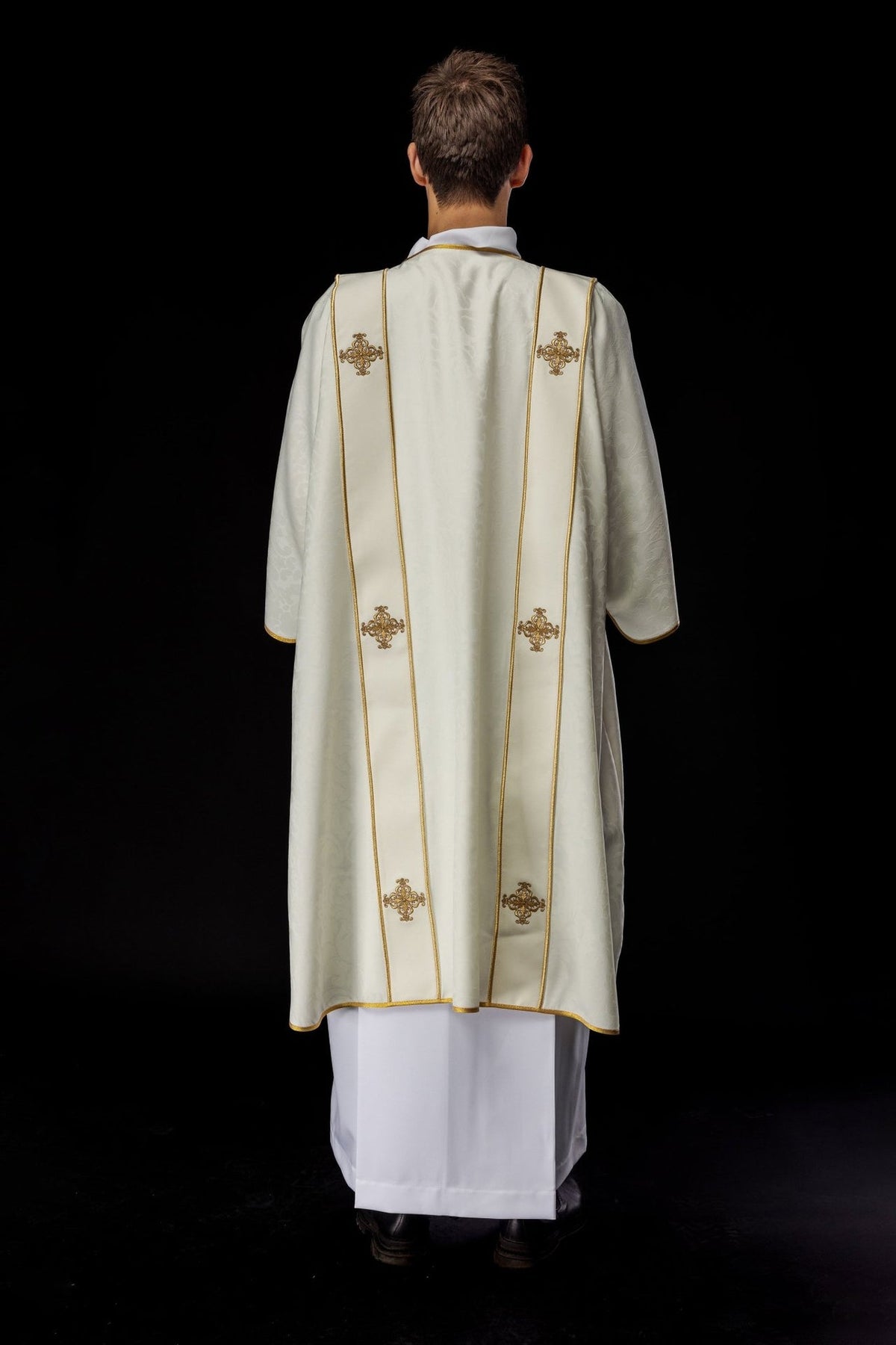 Ecru dalmatic full back view with gold trim and embroidered crosses
