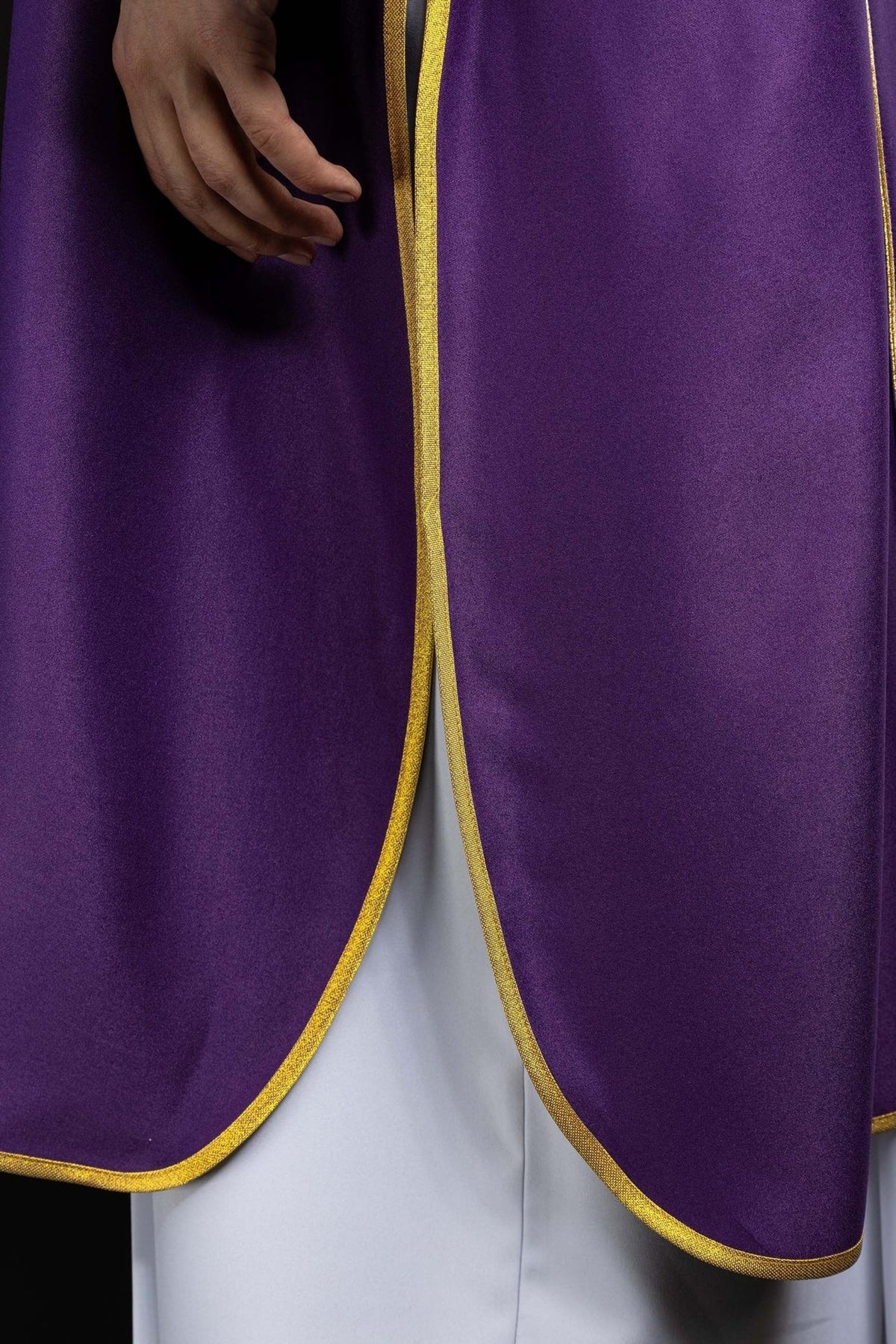 Purple dalmatic side opening with gold trim and white fabric