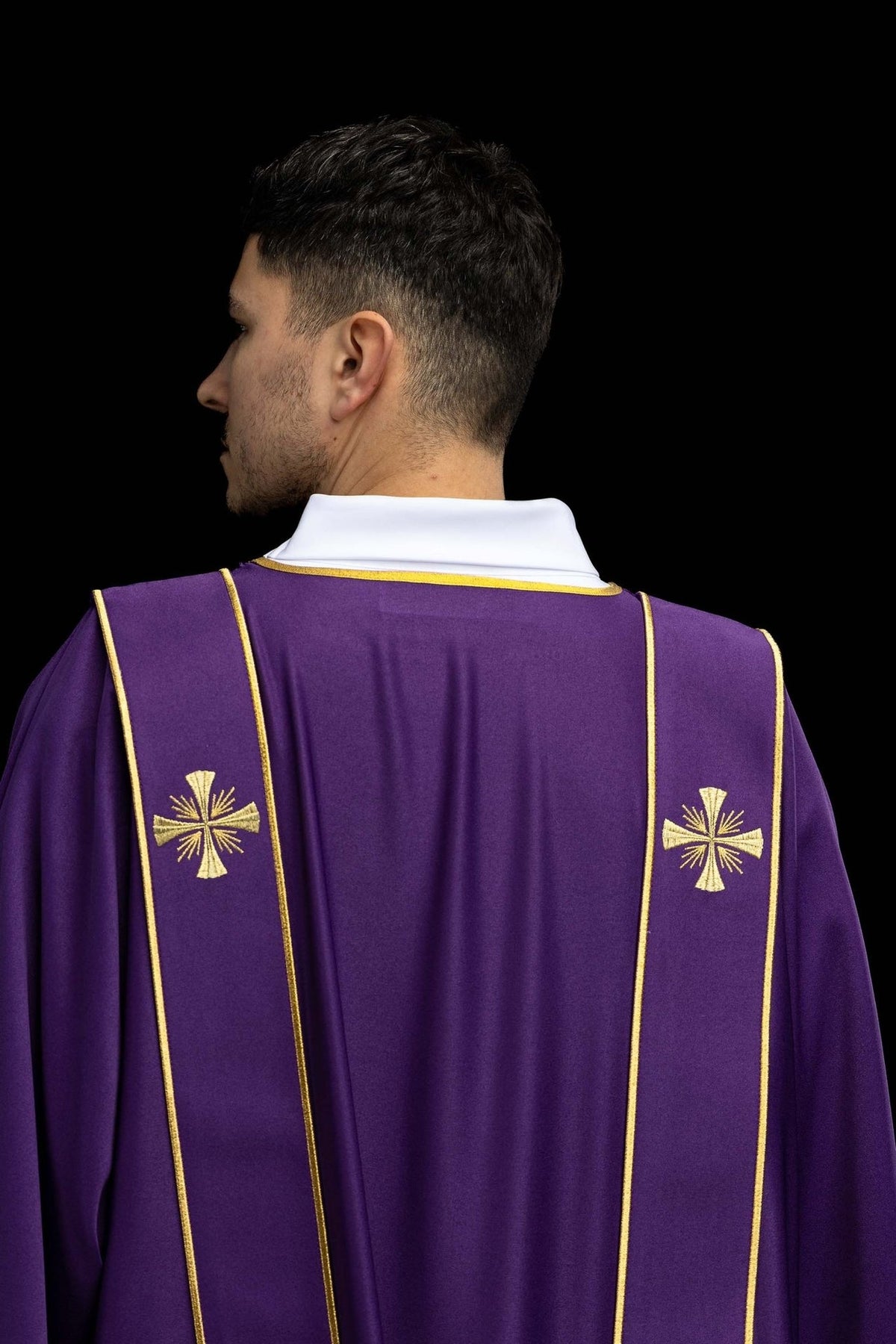 Purple dalmatic back view with gold cross embroidery