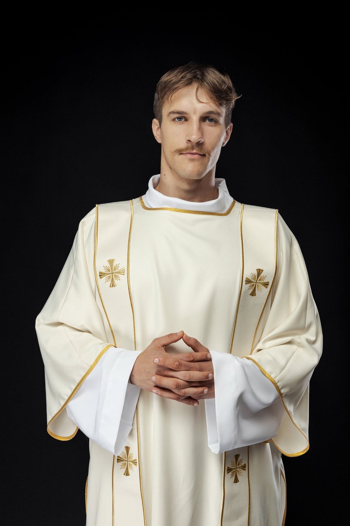 Ecru dalmatic front view with gold orphreys and embroidered crosses