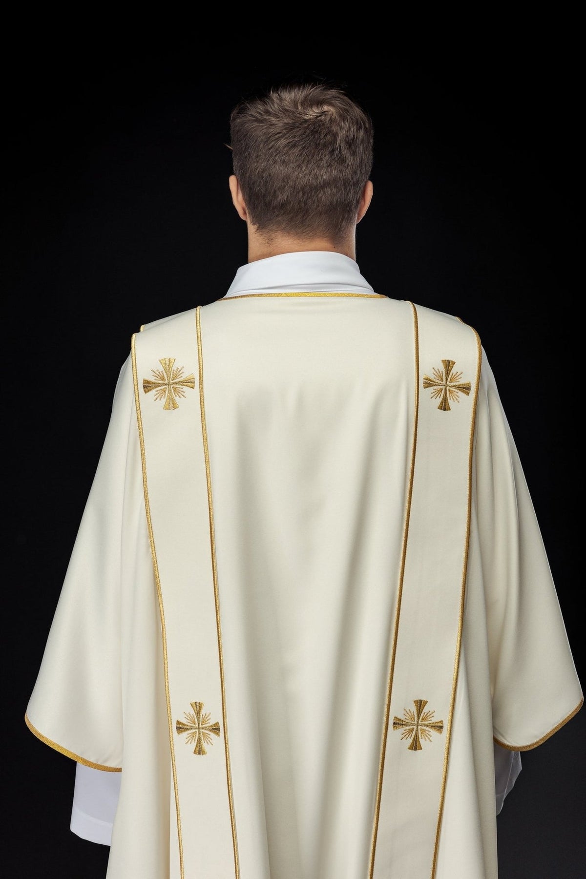 Ecru dalmatic back view with orphreys and embroidered gold crosses