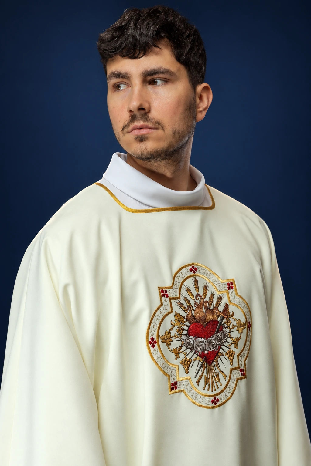 Dalmatic with Heart of Mary Motif in ecru with gold trim and front embroidery, worn front view