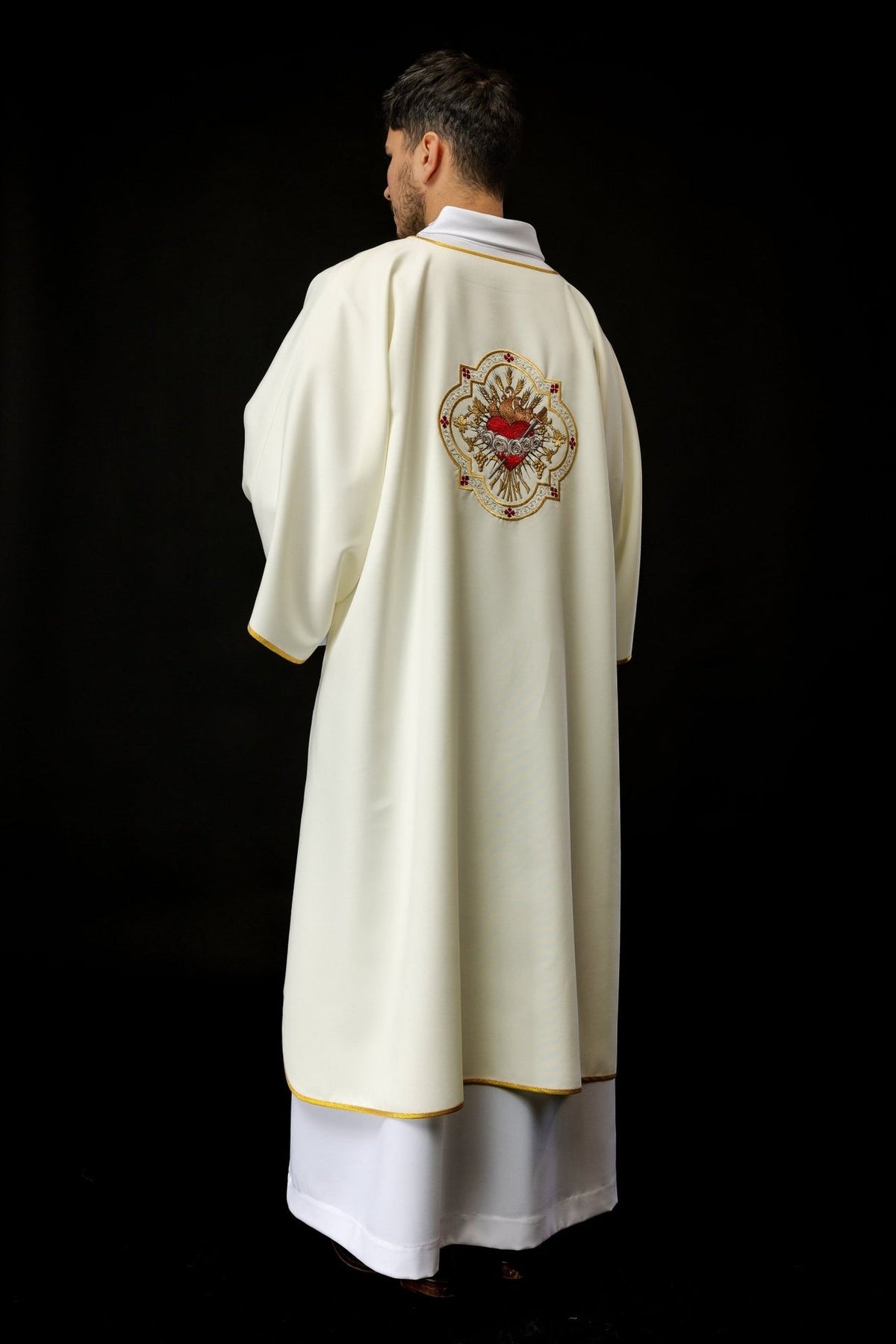 Ecru dalmatic back view with Heart of Mary embroidery and gold trim