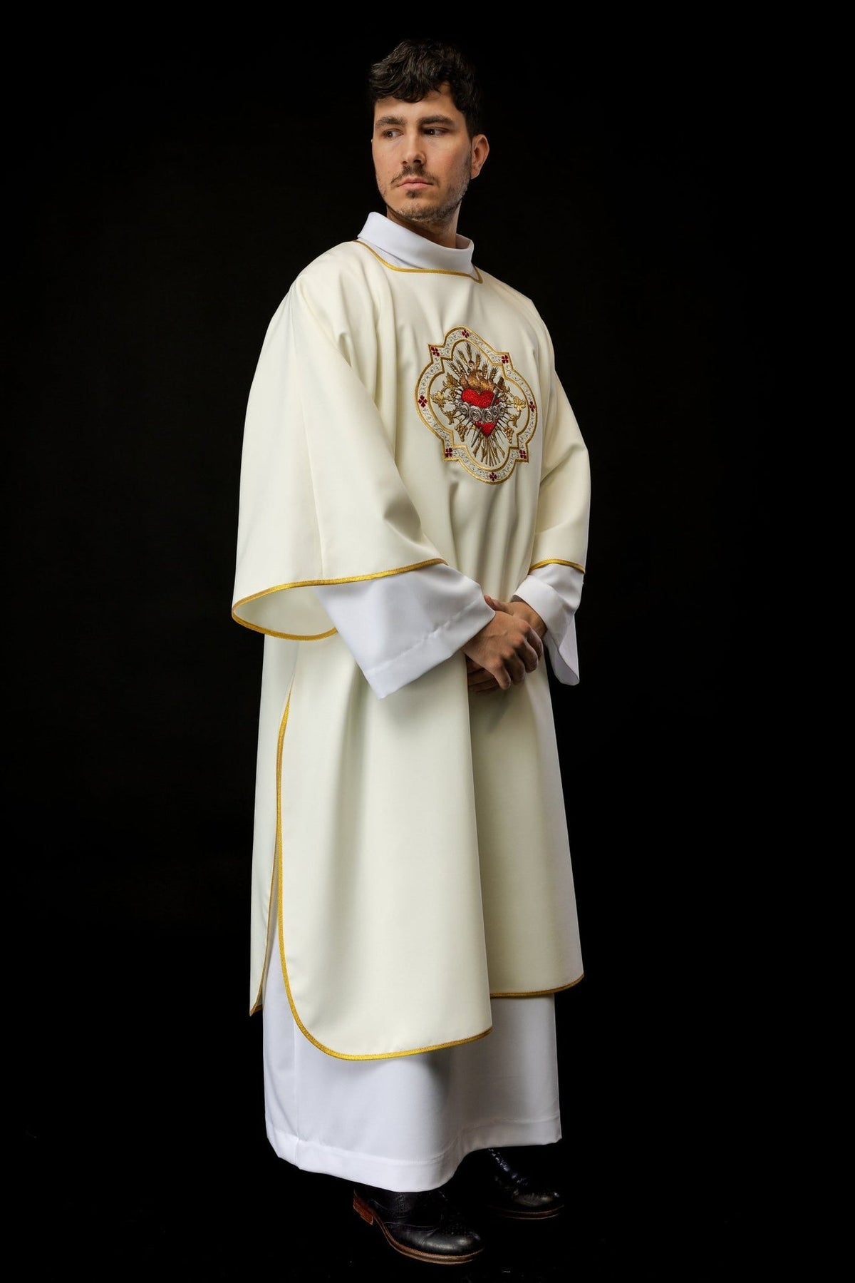 Ecru dalmatic three-quarter front view with Heart of Mary embroidery and gold trim