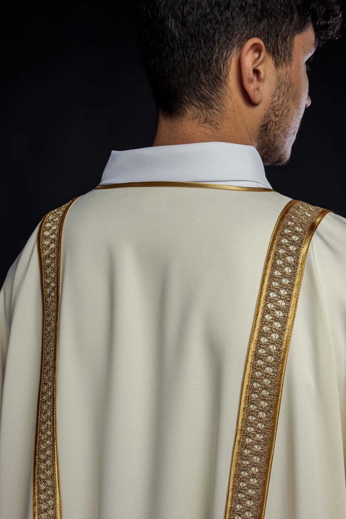 Ecru dalmatic with gold orphreys, back close-up
