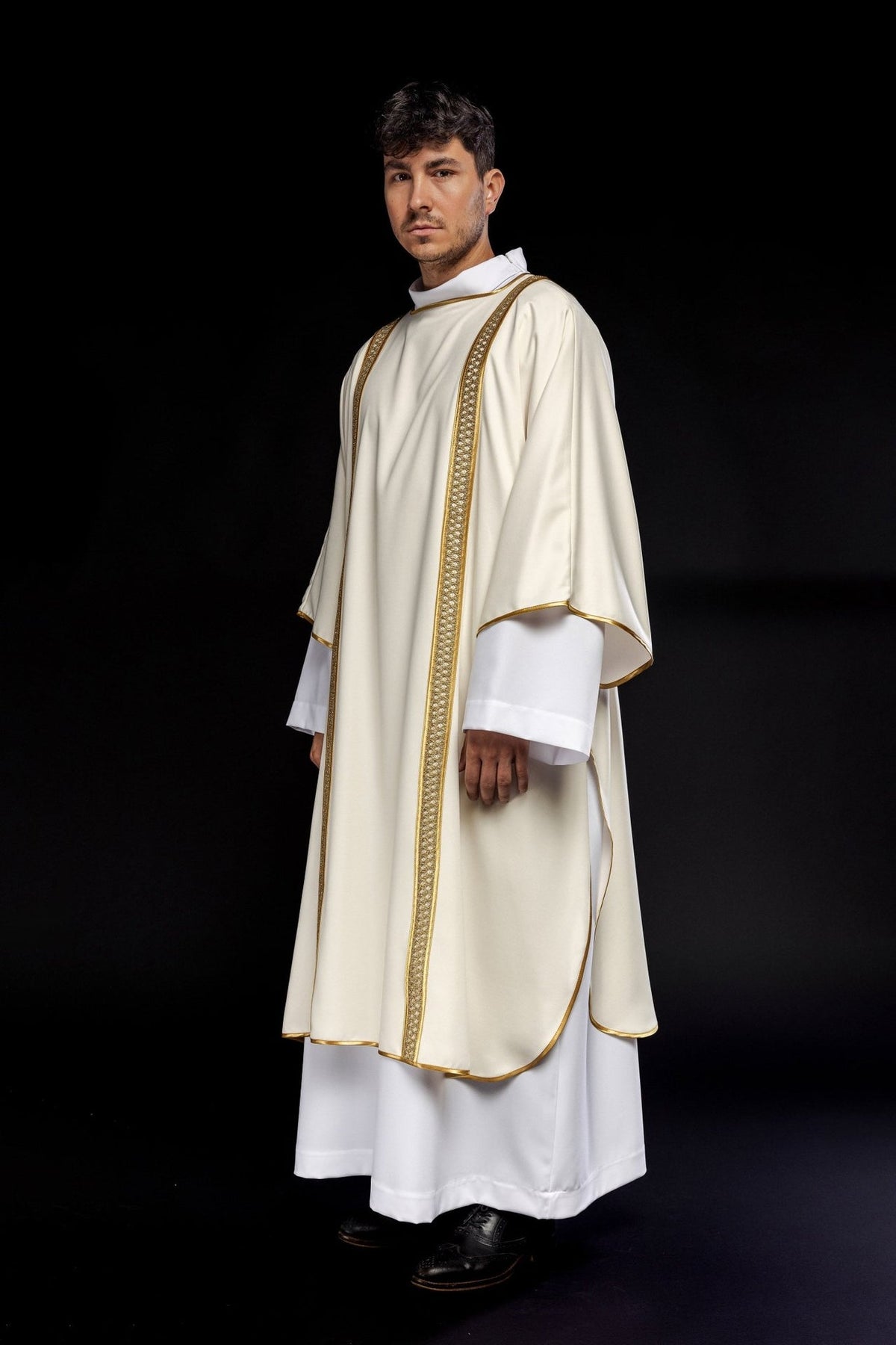 Ecru dalmatic with gold orphrey, three-quarter view