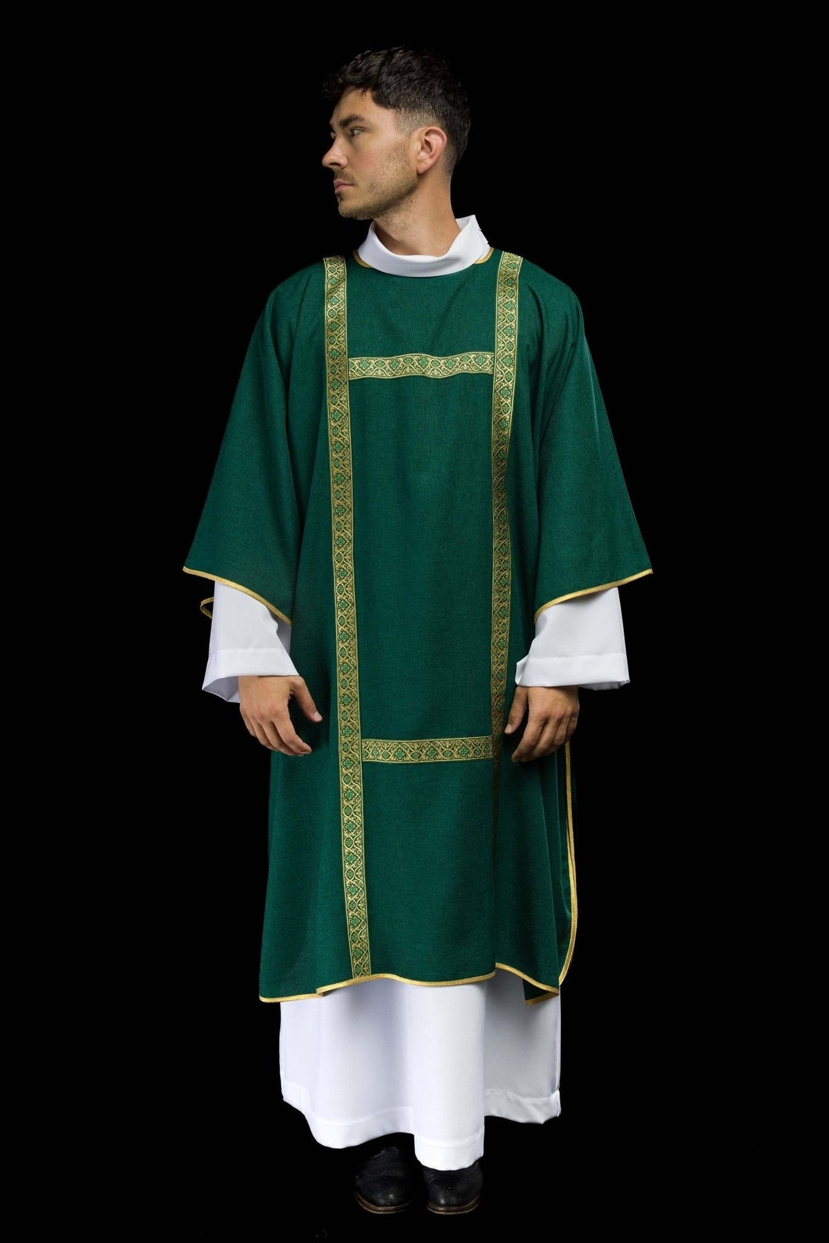 Green dalmatic worn full front view with gold jacquard orphreys and cross motifs