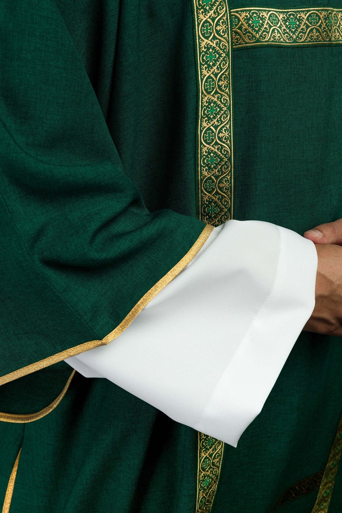 Green dalmatic front detail showing intersecting gold jacquard orphreys