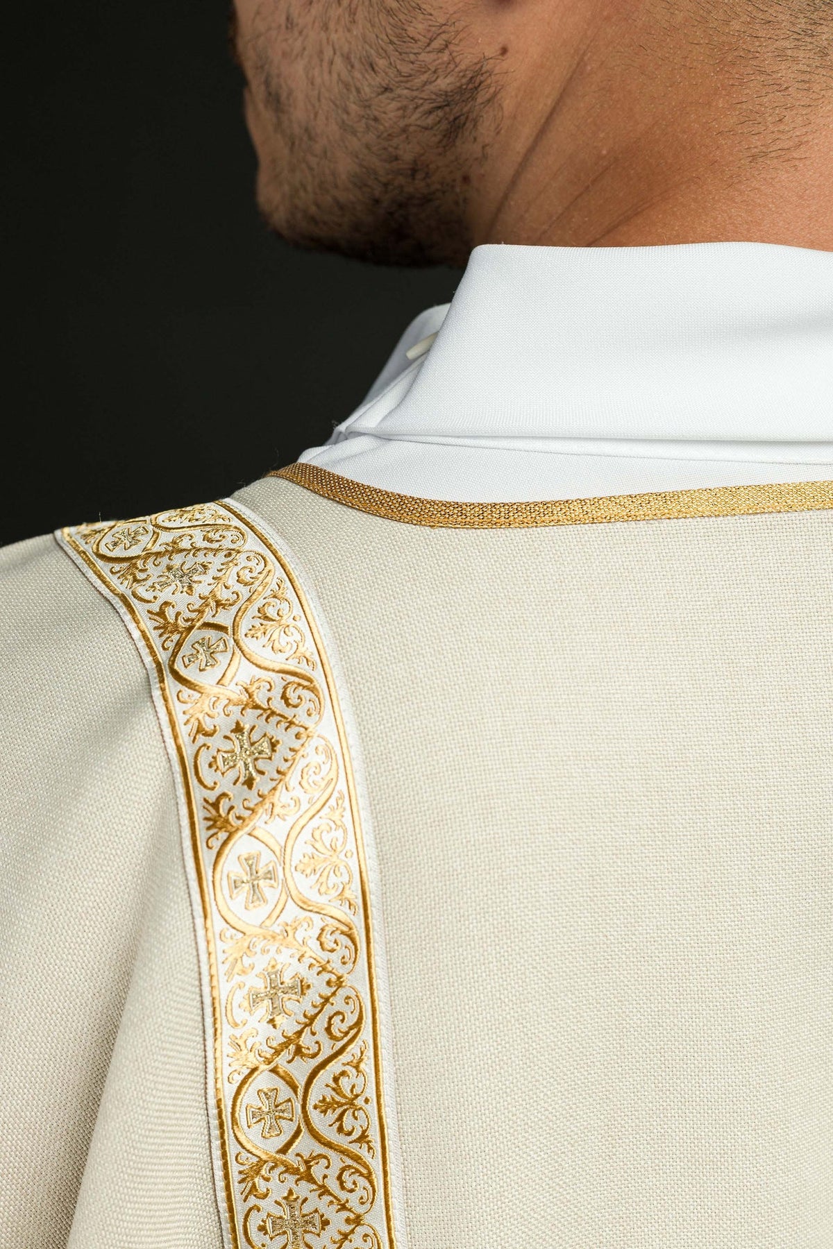 Ecru dalmatic collar and gold jacquard orphrey close-up